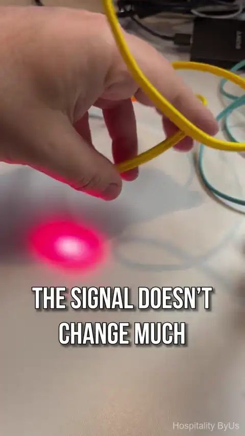 Single-mode fiber cable bending demonstration showing signal stability